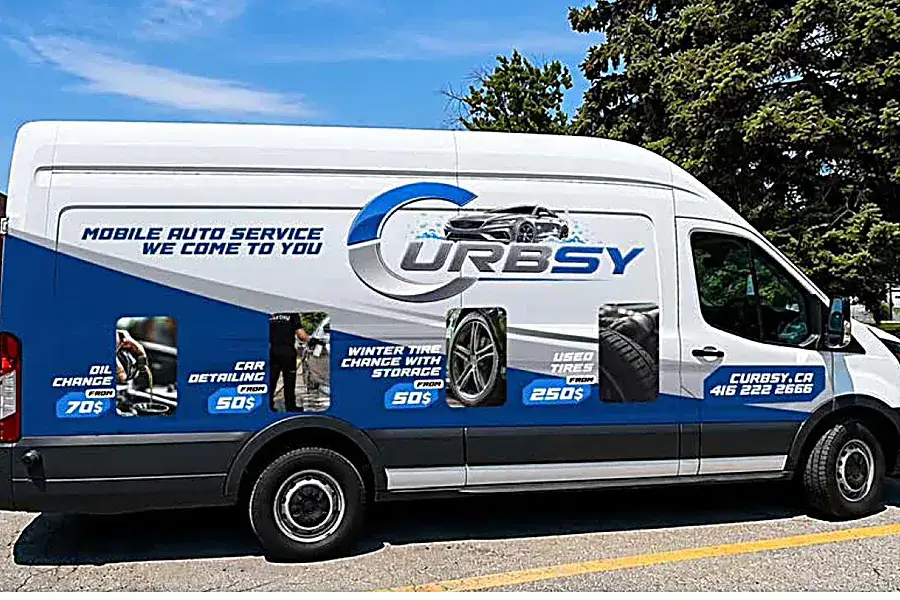 The Curbsy Ford Transit service van parked on a residential street